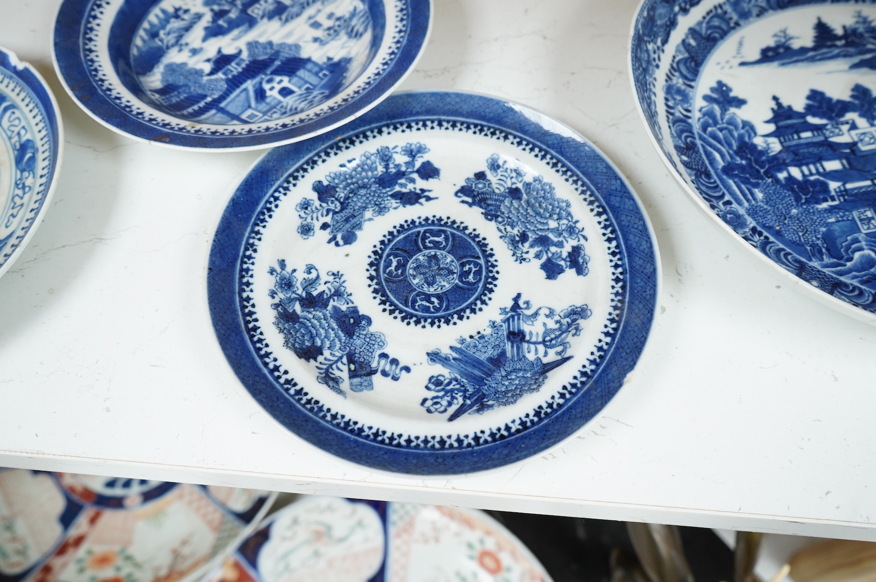 Five 18th / 19th century Chinese export blue and white plates and dishes, largest 27cm in diameter